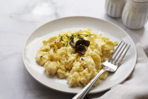How Long After Dental Implants Can I Eat Normally? Recovery and Eating Tips 2 Scrambled eggs served on a plate.