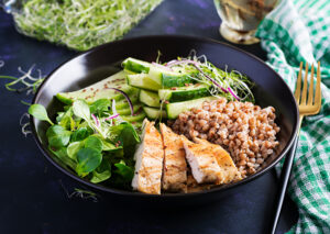 How Long After Dental Implants Can I Eat Normally? Recovery and Eating Tips 3 Chicken and salad served as a balanced meal.