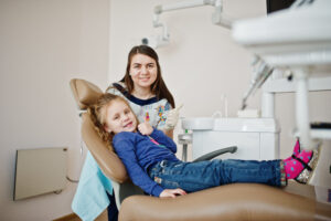 Pediatric Dental Services in Crystal Lake: Complete Care for Growing Smiles 1 Little baby girl at dentist chair. Children dental.