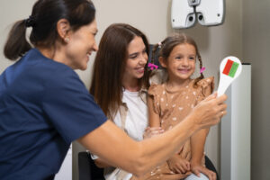 Dental Cleaning for Children in Crystal Lake: Why Early Visits Matter 3 Parent and child smiling together after a dental appointment.