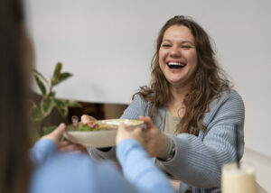 Full Mouth Dental Implants After Years of Dentures: What Are Your Options? 3 Full Mouth Dental Implants After Years of Dentures: What Are Your Options? | plus size female friends spending time together restaurant | Family Dentistry of Crystal Lake