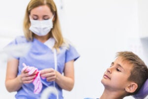 Your Child’s First Dental Visit in Crystal Lake: What Parents Should Expect 2 Dental hygienist preparing for patient treatment during routine dental appointment