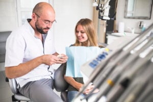 Dentist Near Cary, IL: Finding Quality Dental Care for the Whole Family 2 Patient discussing personalized treatment options with a dentist during a comprehensive dental consultation