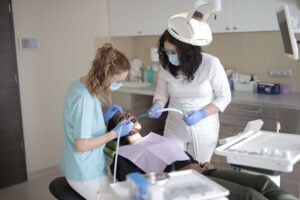 Dentist Near Huntley, IL: How to Find the Right Dental Care for Your Family 2 Dental team providing preventive dental care during a routine checkup and cleaning appointment in Crystal Lake.