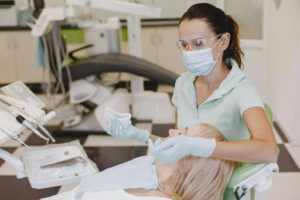 Sports Mouthguards for Young Athletes in Crystal Lake: Protecting Smiles On and Off the Field 1 Dentist discussing custom sports mouthguard options with a patient during a preventive dental consultation in Crystal Lake.