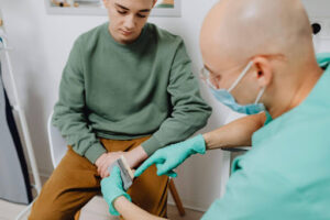 All-on-4 Dental Implants Cost in Crystal Lake: What Patients Should Know Before Treatment 2 Dentist explaining All-on-4 dental implant benefits and long-term value to a patient