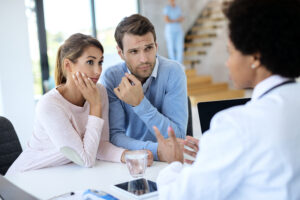 Emergency Dentist in Crystal Lake: What to Do in a Dental Emergency 1 Dentist reviewing dental insurance coverage and treatment options with a patient during a consultation