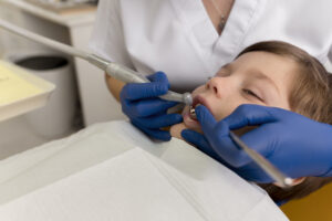 Fluoride Treatments for Kids in Crystal Lake, IL - What Parents Should Know (2026) 2 Child getting a fluoride treatment during a dental visit