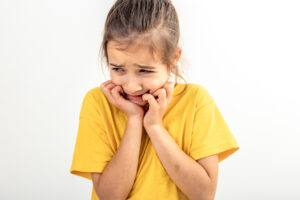 Cavities in Kids: Treatment, Prevention & Cost in Crystal Lake, IL (2026) 2 Child with tooth pain from a cavity.